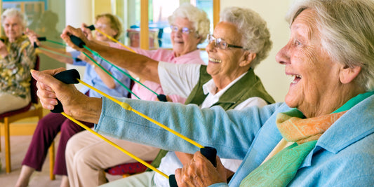 Elderly women doing exercises with resistance bands