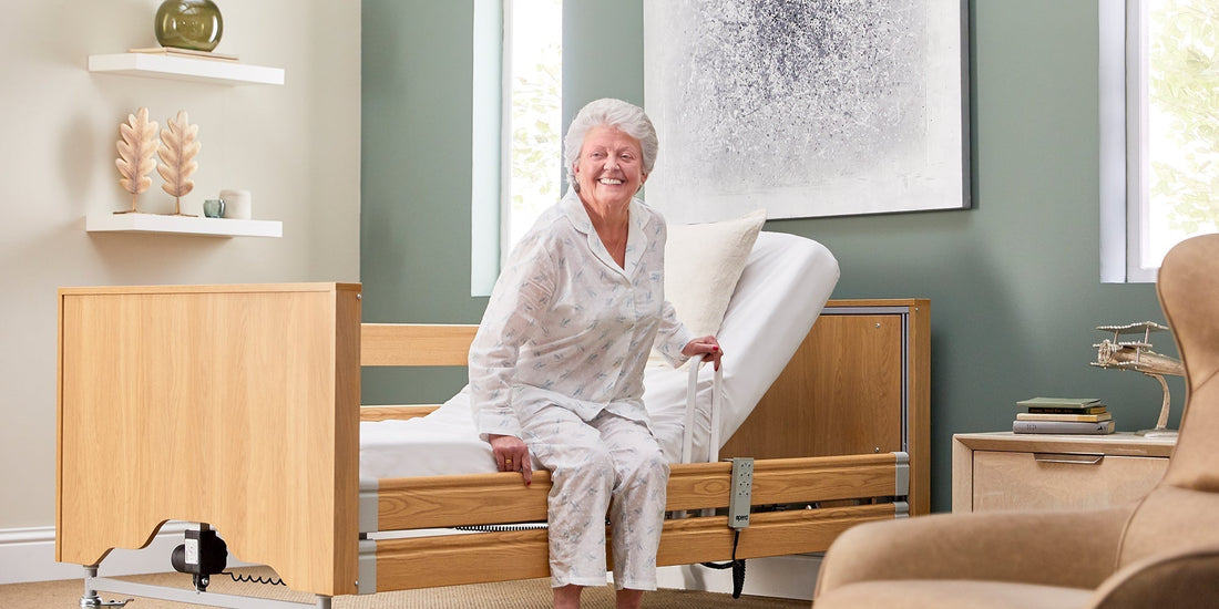 A elderly woman holding a grab rail to get out of a profiling bed 