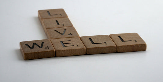 words from a scrabble board that spell out live well