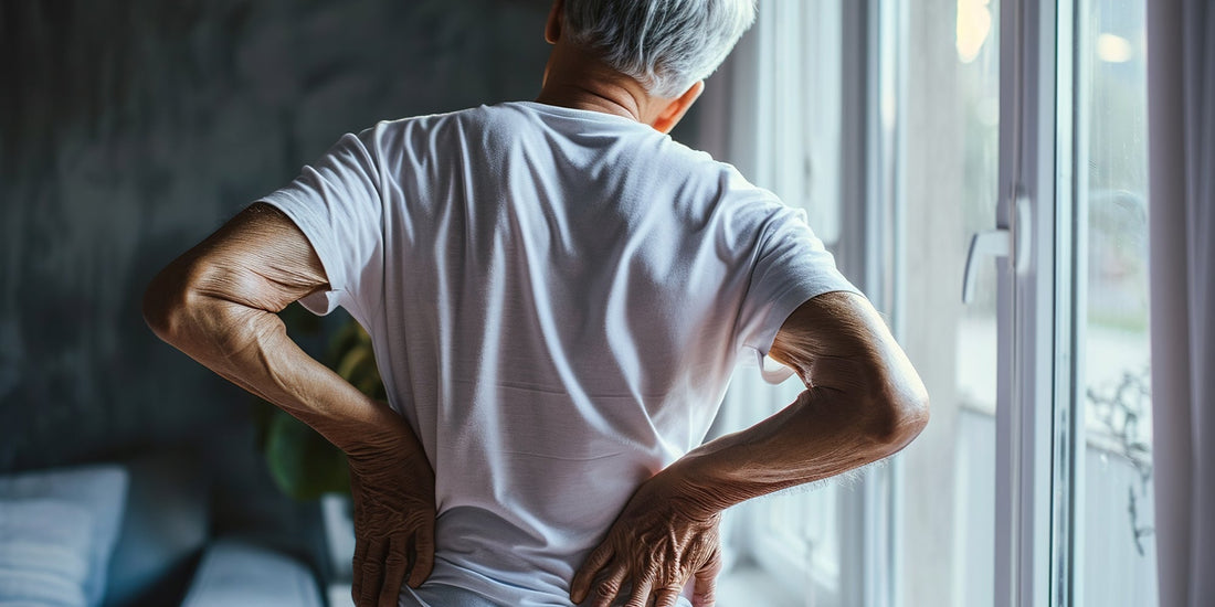 An older gentleman holding his side