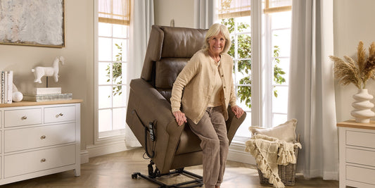 A older lady using the lift feature of an opera riser recliner chair