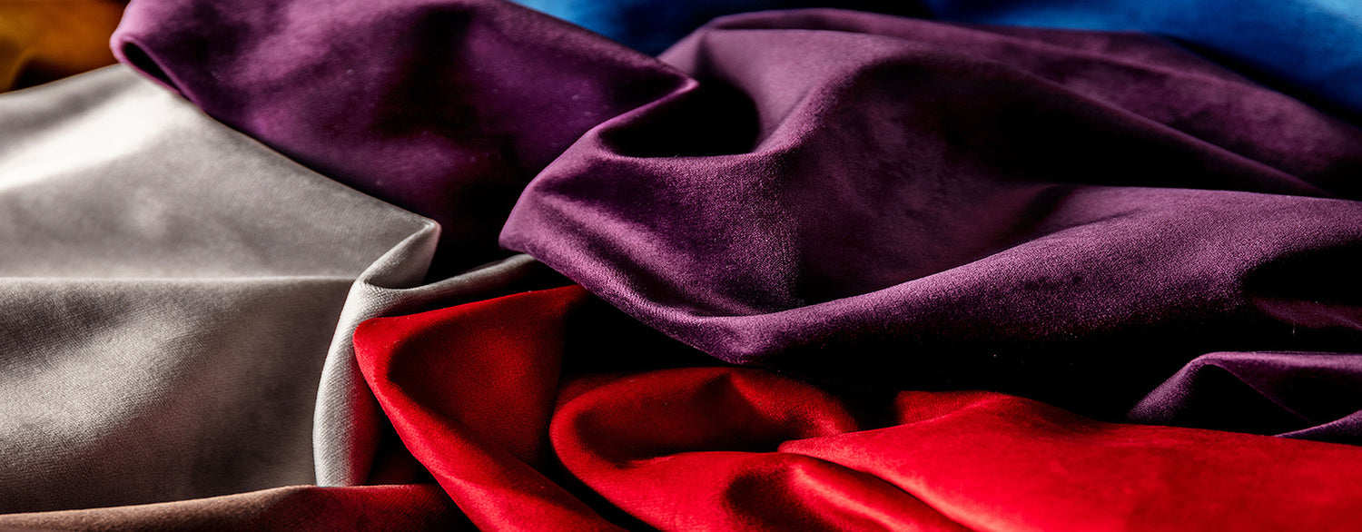 Silver, purple and red silk fabrics.