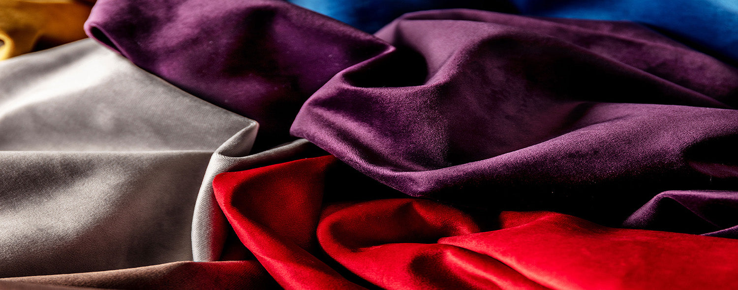 Silver, purple and red silk fabrics.