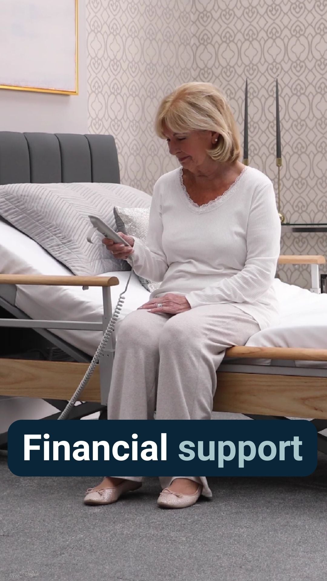 A lady sat on the edge of a profiling bed holding remote with the caption 'Financial support'