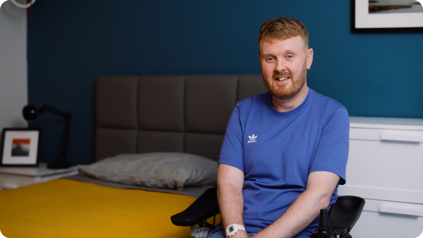 Opera customer Niall Harris, sat in a wheelchair next to his profiling bed