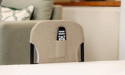 Motion Grab Rail with a linen cover on it and a wireless control in the pocket