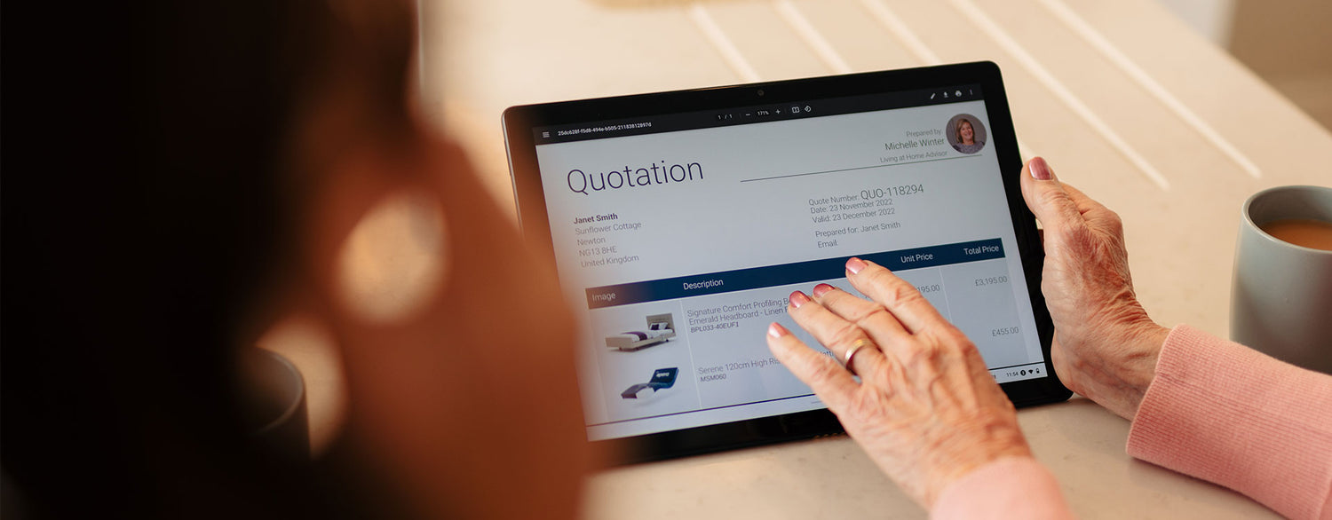 Woman's hand tapping on a tablet showing an order quotation from Opera Beds.