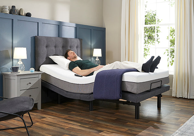 A man laid in the zero-gravity position in an Opera bed